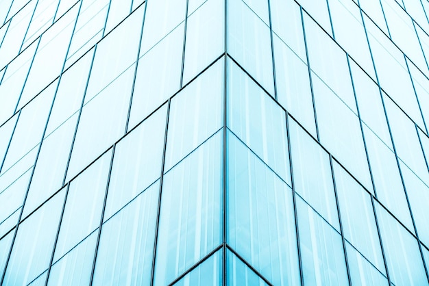 Underside panoramic and perspective view to steel blue glass high rise building skyscrapers business concept of successful industrial architecture