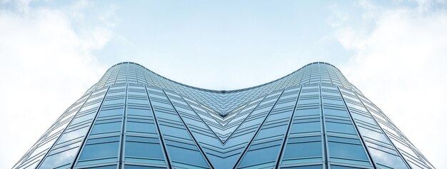 Underside panoramic and perspective view to steel blue glass high rise building skyscrapers, business concept of successful industrial architecture