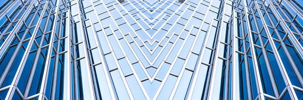 Underside panoramic and perspective view to steel blue glass high rise building skyscrapers, business concept of successful industrial architecture