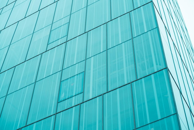 Underside panoramic and perspective view to steel blue glass high rise building skyscrapers