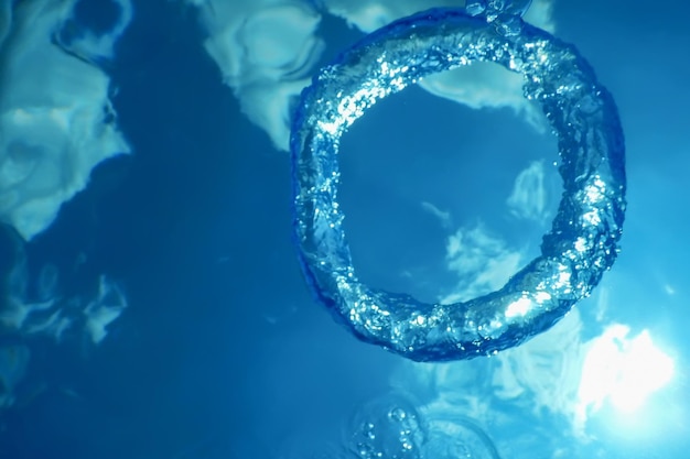 Underwater Bubble Ring Ascends towards Sun