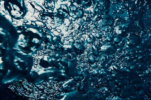 Photo underwater bubbles with sunlight. underwater background bubbles.