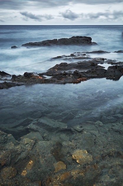 Underwater & emerging rocks seascape