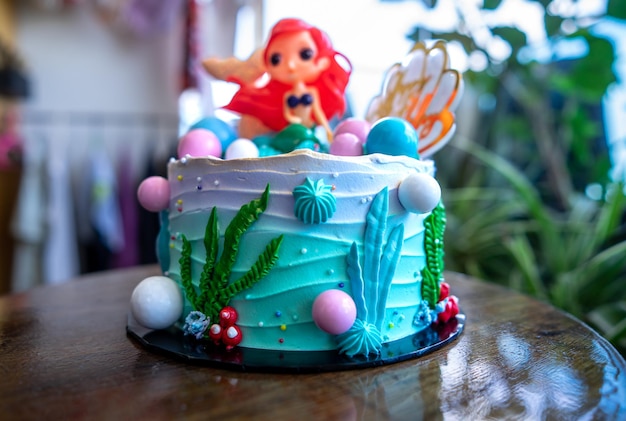 Underwater mermaid cake on the wooden table