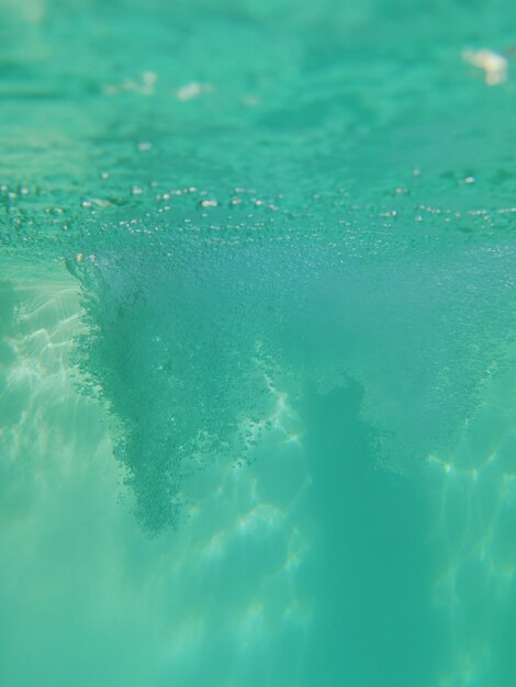 Underwater photo into pool in a summer day