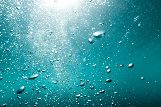 Underwater View of Bubbles In Deep Blue Sea Close Up Water Background