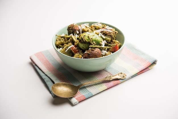 Undhiyu is a Gujarati mixed vegetable dish, specialty of Surat, India. Served in a bowl with or without poori