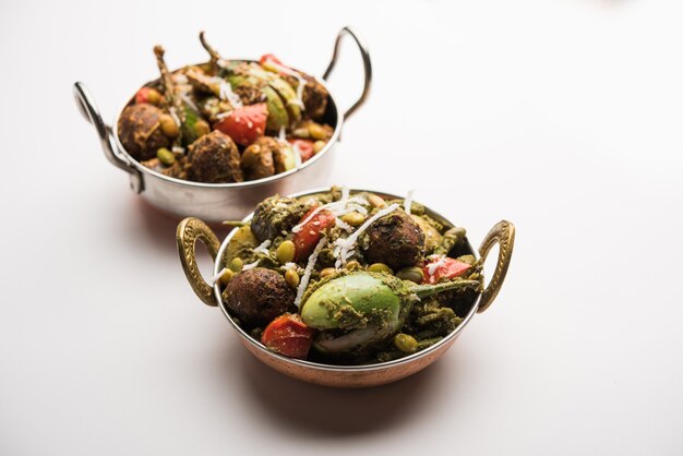 Undhiyu is a Gujarati mixed vegetable dish, specialty of Surat, India. Served in a bowl with or without poori