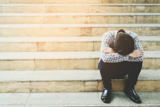 Unemployed guy on stairs