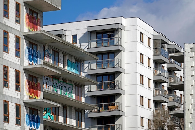 Unfinished abandoned residential building covered with graffiti