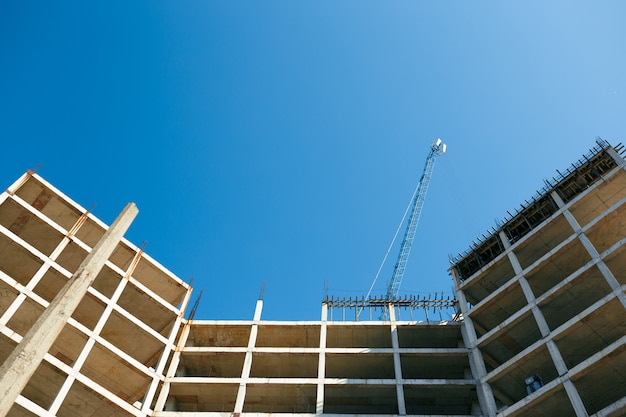 Unfinished cement building at a construction site in the summer