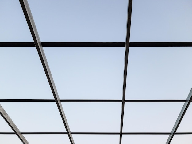 The unfinished steel framework of the modern house roof