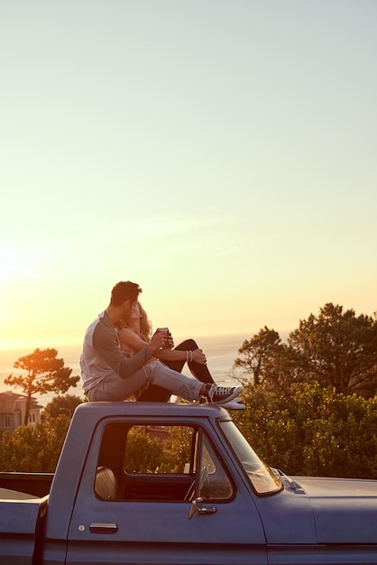 On an unforgettable road trip Shot of an affectionate young couple on a roadtrip