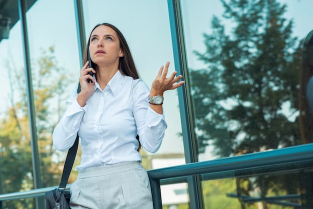 Unhappy businesswomen talking on phone. businesswomen have
problem with client.