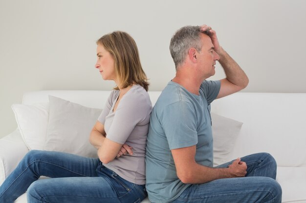 Unhappy couple not talking after an argument at home