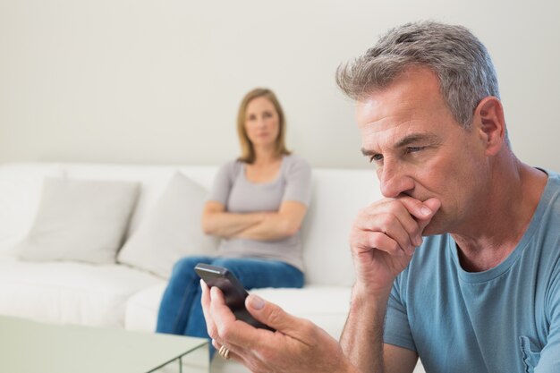 Unhappy couple not talking after an argument at home