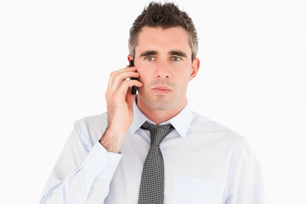 Unhappy man making a phone call