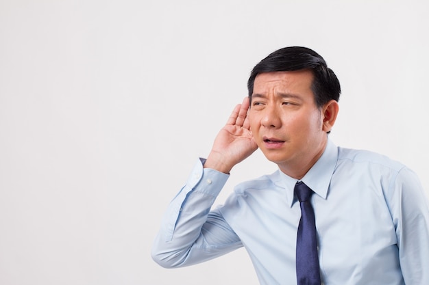 Unhappy sad negative business man listening to bad news