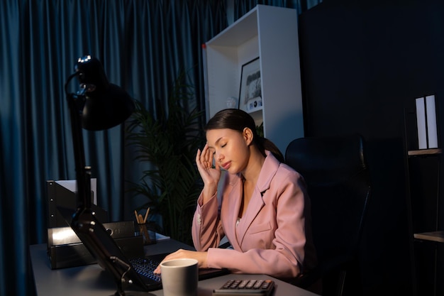an unhappy sitting businesswoman with stressful feelings headache postulate