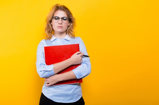 Unhappy woman with big folder