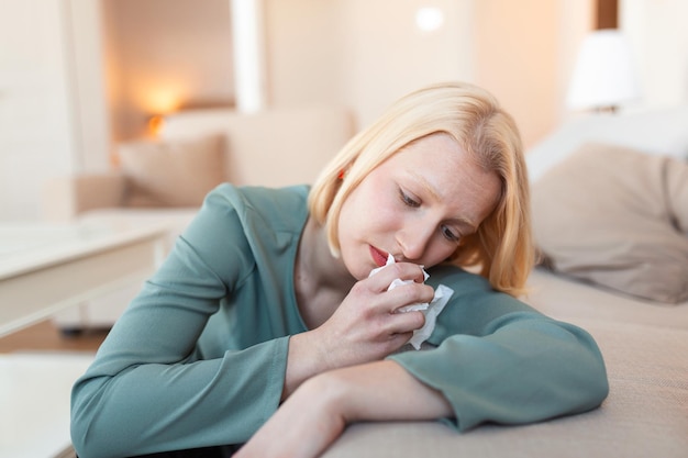 Premium Photo | Unhappy young woman covering face with hands crying alone  close up depressed girl sitting on couch at home health problem or thinking  about bad relationships break up with boyfriend