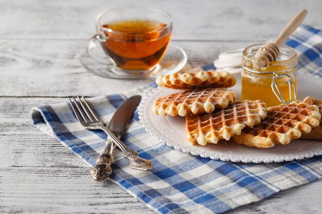 Unhealphy breakfast with cup of tea for lover