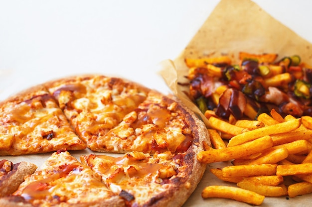 Unhealthy concept Fast Food  Pizza Fried Potato on a white background