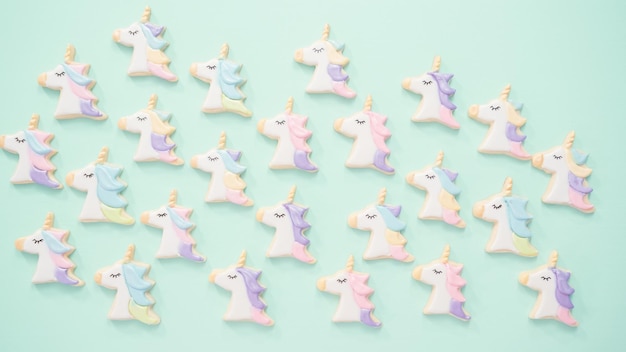 Unicorn sugar cookies decorated with royal icing and food glitter.