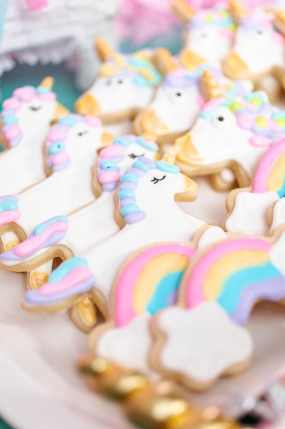 Unicorn sugar cookies decorated with royal icing at the kids birthday party.