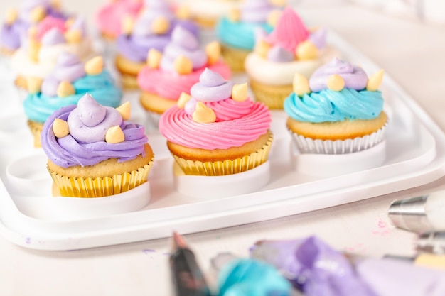 Unicorn theme vanilla cupcakes for kids birthday party.