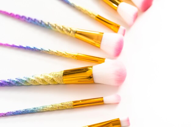 Unicorn-themed makeup brush set on a white background.