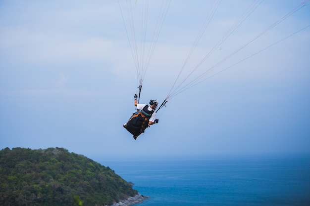 An unidentified Paramania Paramotor show in Children day. Photo at Phuket, Thailand