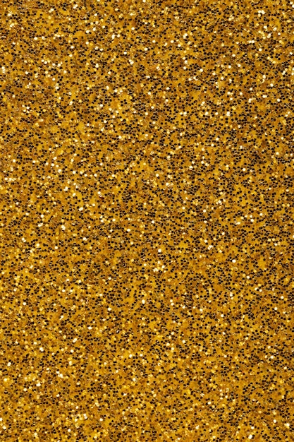 Uniform background of golden color with songs gold background with sparkles and glitters
