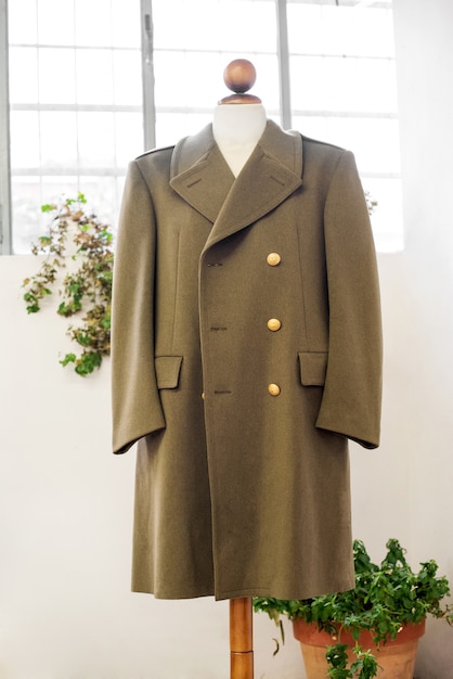 Photo uniform coat hanging on mannequin