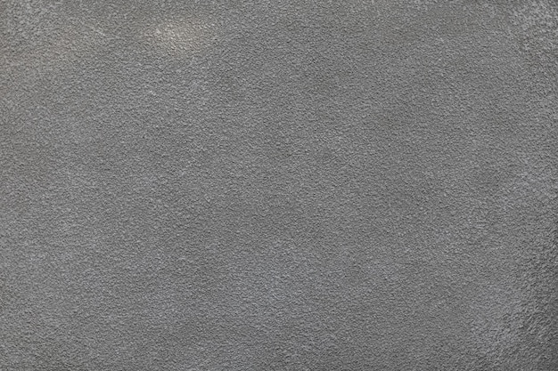 Uniform gray rusty concrete texture. Macro. Top view.