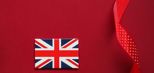 Union Jack flag of Great Britain on red background Queen's Platinum Jubilee and holiday celebration