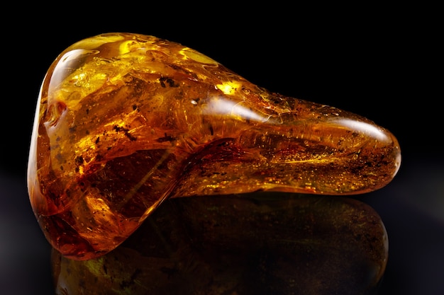 A unique piece of solar amber on black