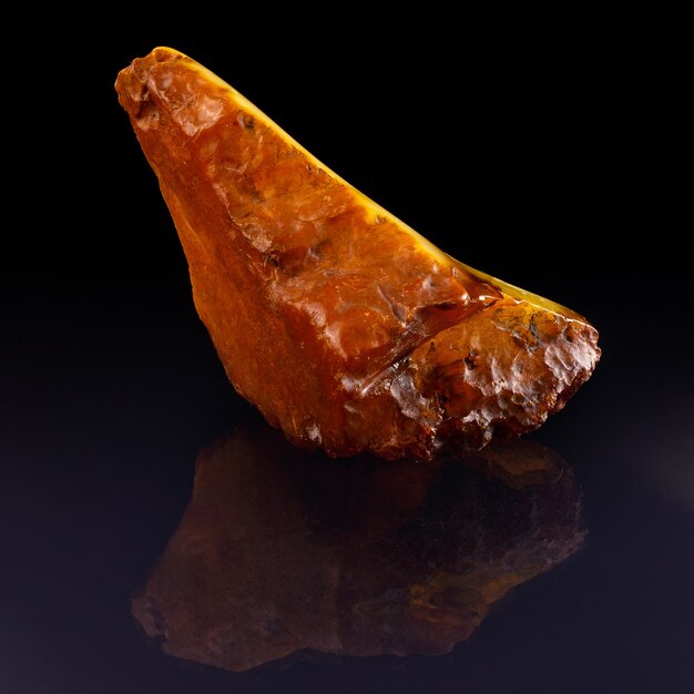 A unique piece of solar amber on black