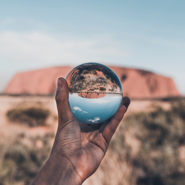 A unique point of view of Uluru through crystal ball. Previously known as Ayer's Rock