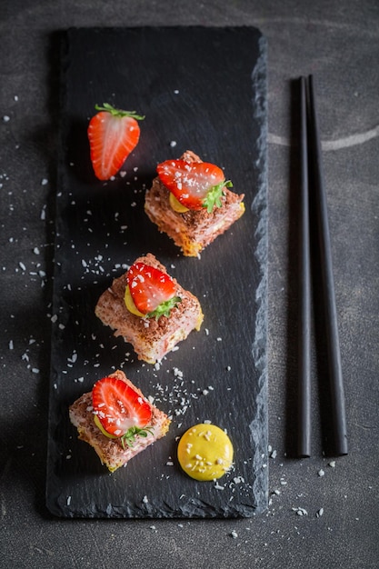 Unique sweet sushi sprinkled with coconut shavings