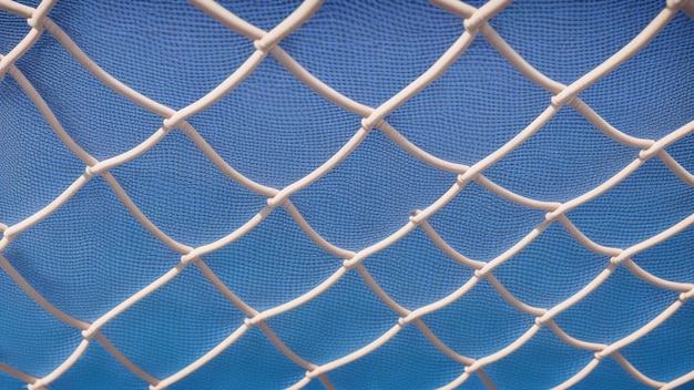 Photo a unique view of a fence with a blue sky in the background ai generative