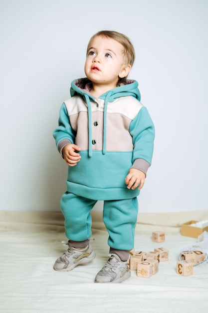 Unisex clothes for babies cute baby in cotton set suit on light background kids fashion