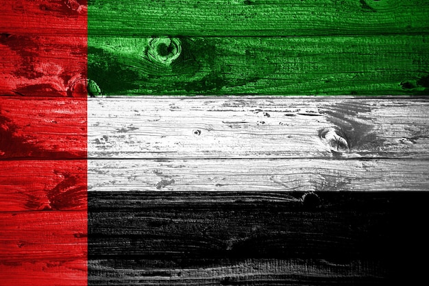 United arab emirates flag on wooden planks background wood\
flag