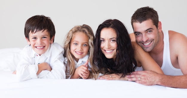 United family having fun together on the bed