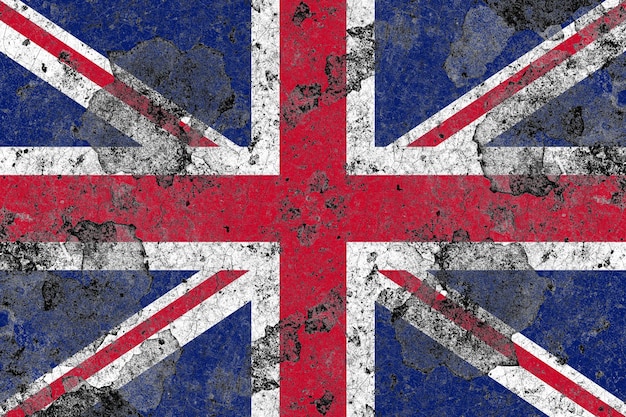 Photo united kingdom flag on a damaged old concrete wall surface