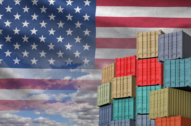 United states of america flag and big stack of shipping cargo containers in docks with sky