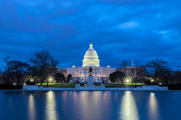 The United States Capitol with reflection at night, Washington DC, USA