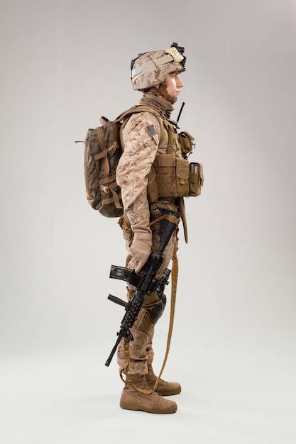 United states marine corps special operations command raider\
with weapon. studio shot