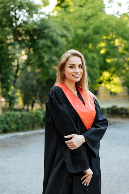 University graduate in a black gown The student completed university and obtained a masters degree