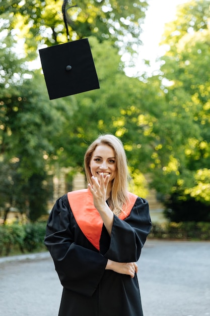 University graduate in a black gown The student completed university and obtained a masters degree